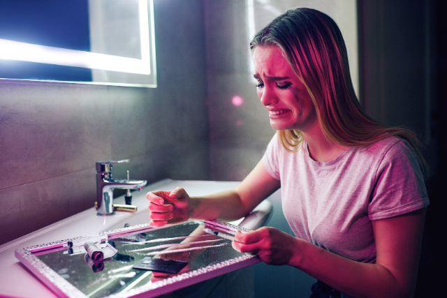 woman crying over cocaine
